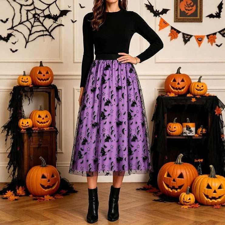 Purple Halloween tulle midi skirt styled with a black long-sleeve top and ankle boots